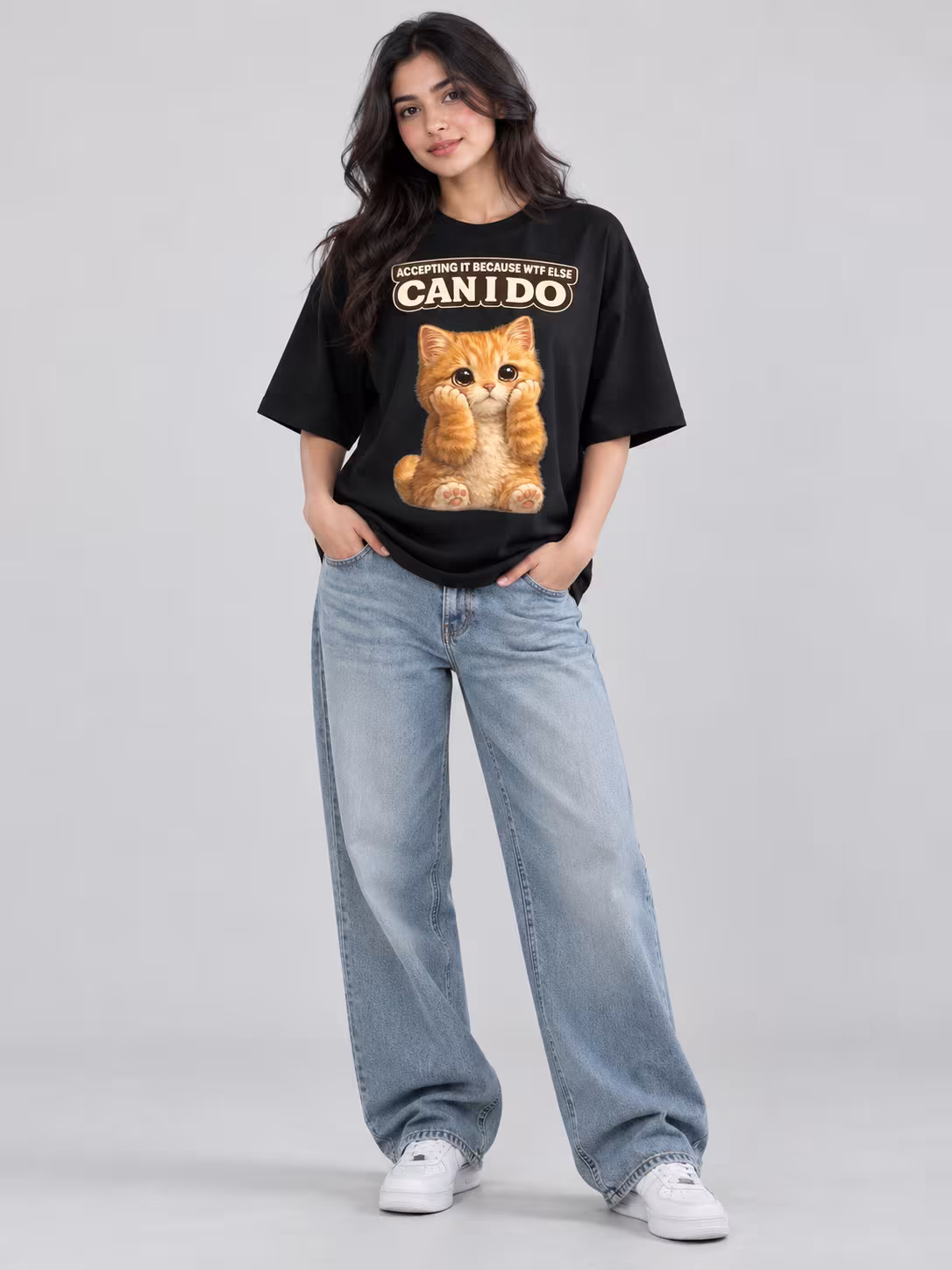 Accepting Fate Cat Unisex Oversized T-Shirt in Black, worn by a model