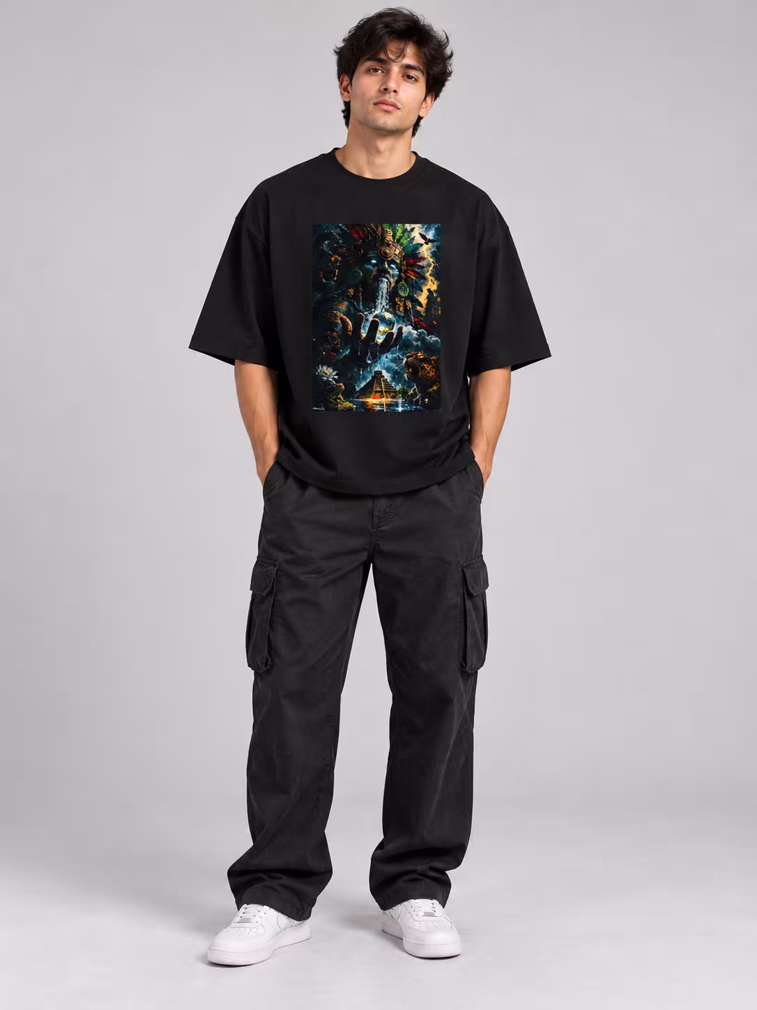 Aztec deity Unisex Oversized T-Shirt in Black, worn by a model