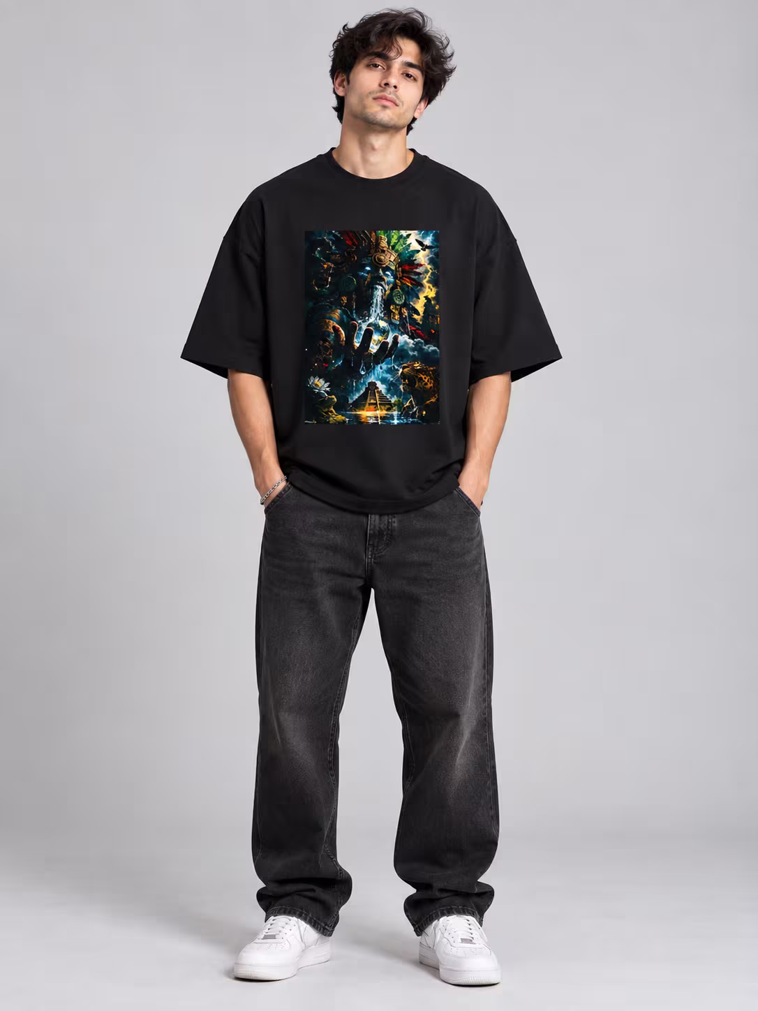 Aztec Deity Unisex Terry Oversized Tee in Black, worn by a model