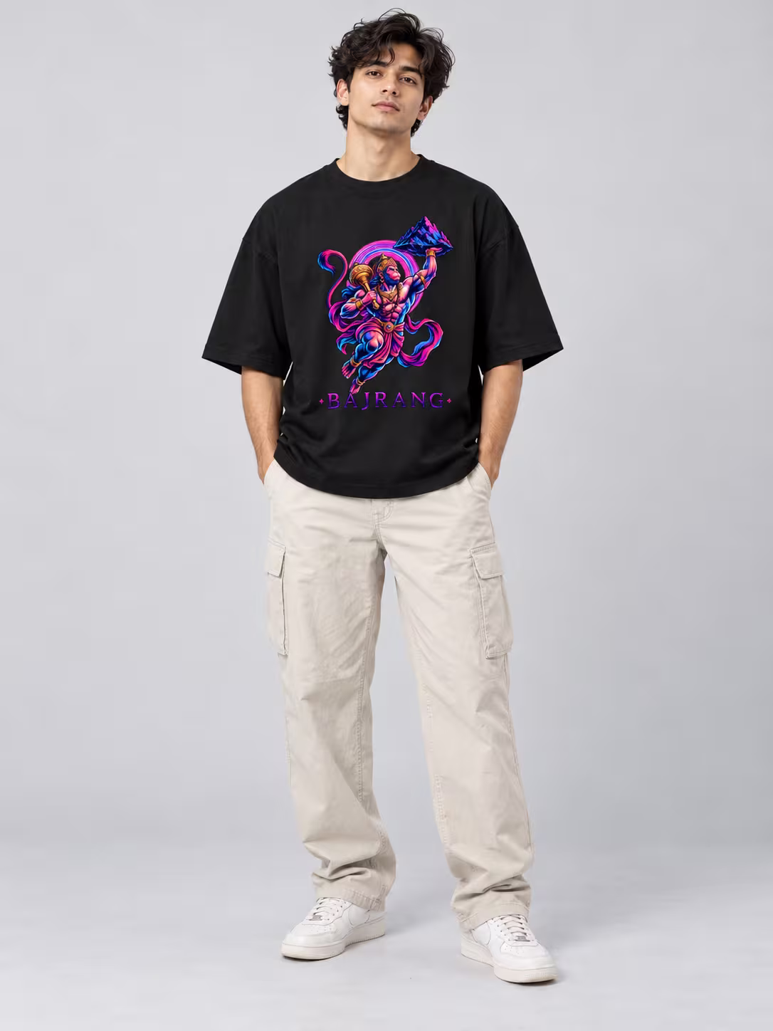 Hanuman t-shirt: Bajrang Neon Unisex Oversized T-Shirt in Black, worn by a model