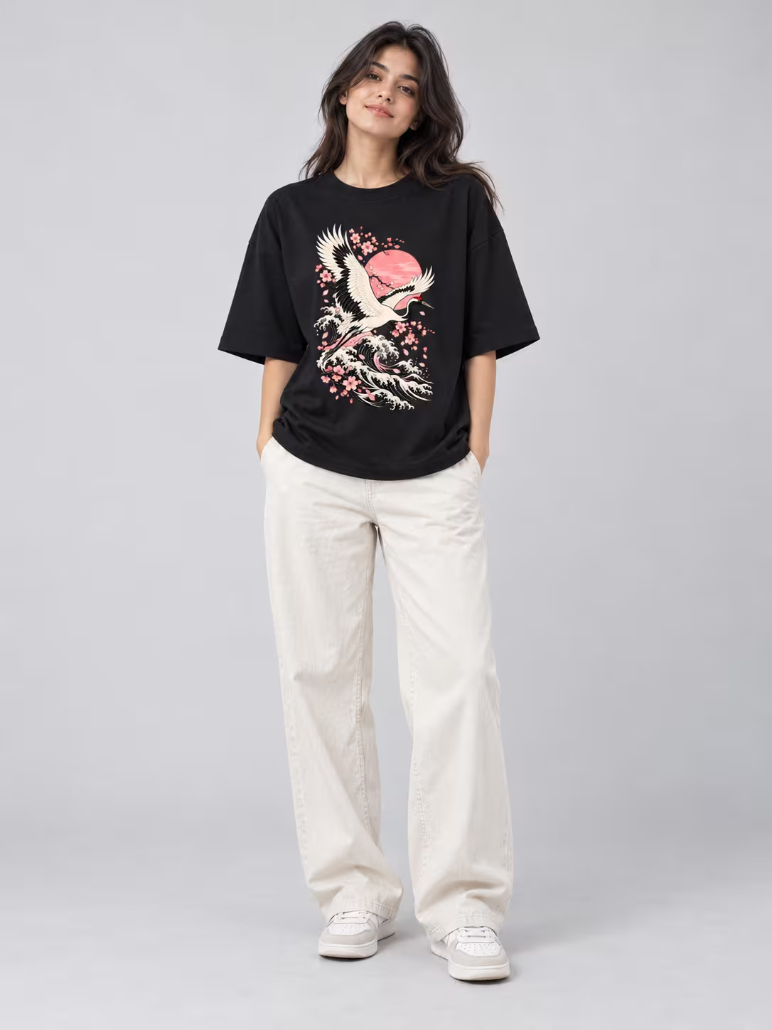 Japanese wave t-shirt: Crane Wave Unisex Oversized T-Shirt in Black, worn by a model
