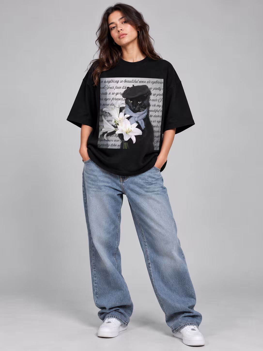 Flower Cat Unisex Terry Oversized Tee in Black, worn by a model