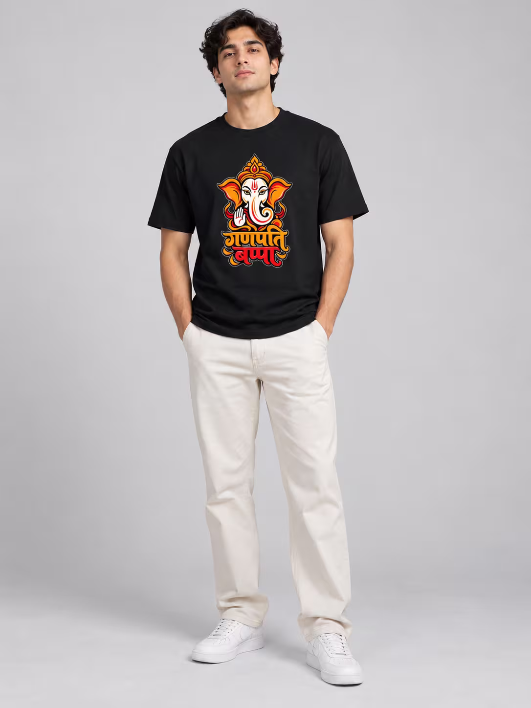 Ganpati Bappa Regular Fit T-Shirt in Black, worn by a model