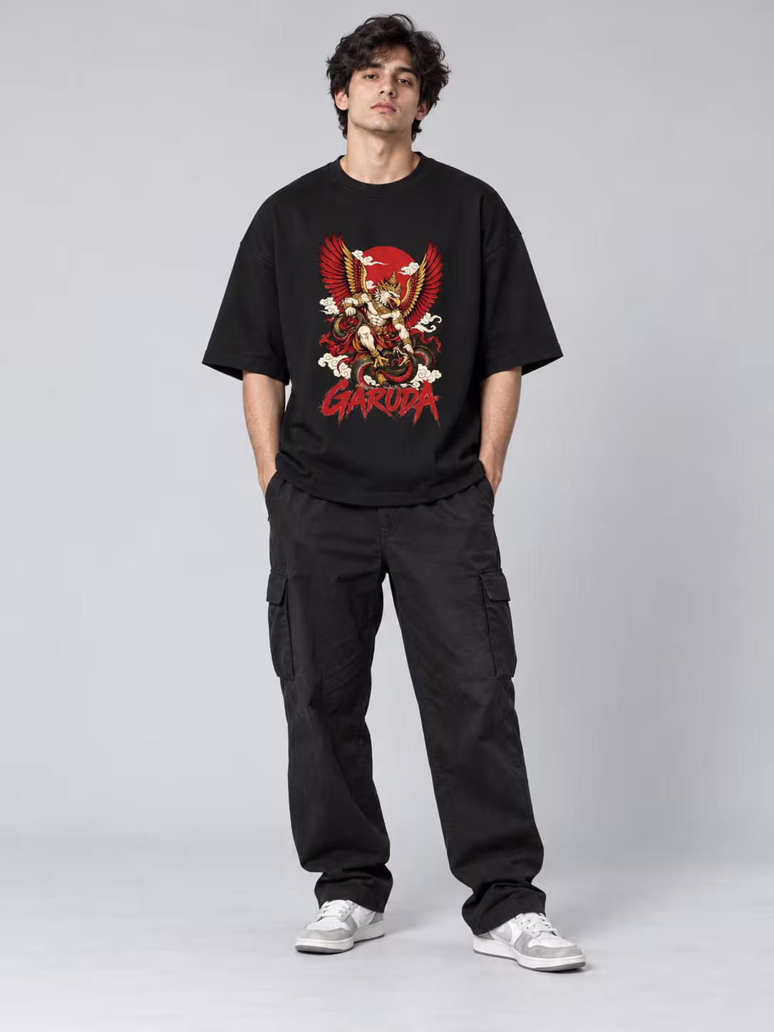 Garuda Unisex Terry Oversized Tee in Black, worn by a model
