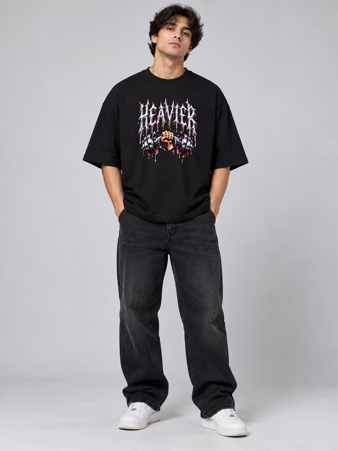 Heavier Unisex Oversized T-Shirt in Black, worn by a model