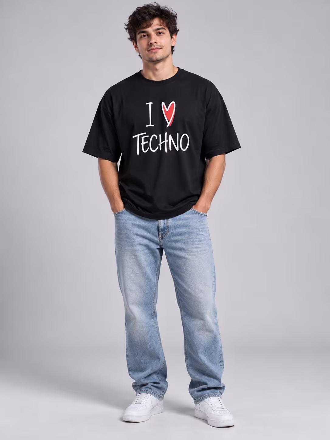 I Love Techno Unisex Oversized T-Shirt in Black, worn by a model