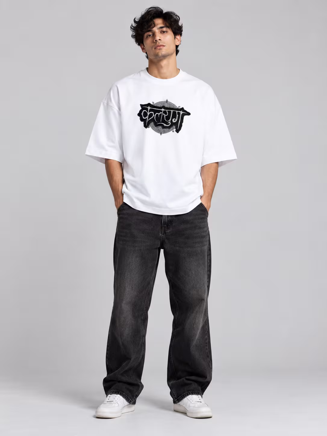 Kalyug Unisex Terry Oversized Tee in White, worn by a model