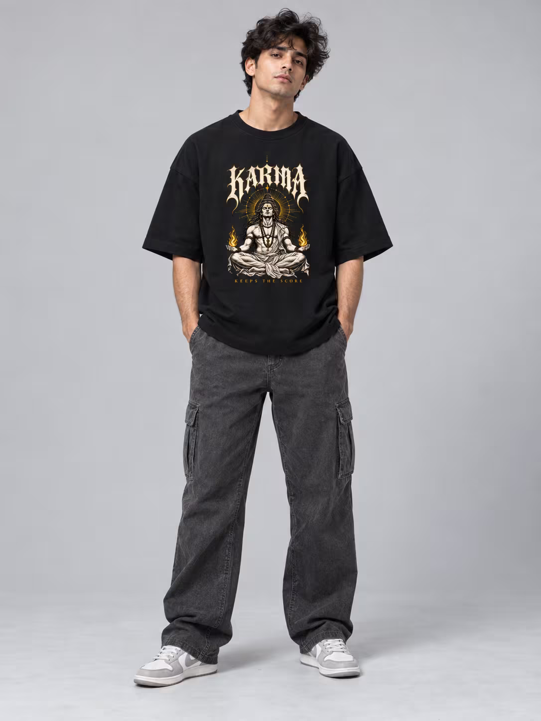 Karma Keeps Score Unisex Terry Oversized Tee in Black, worn by a model