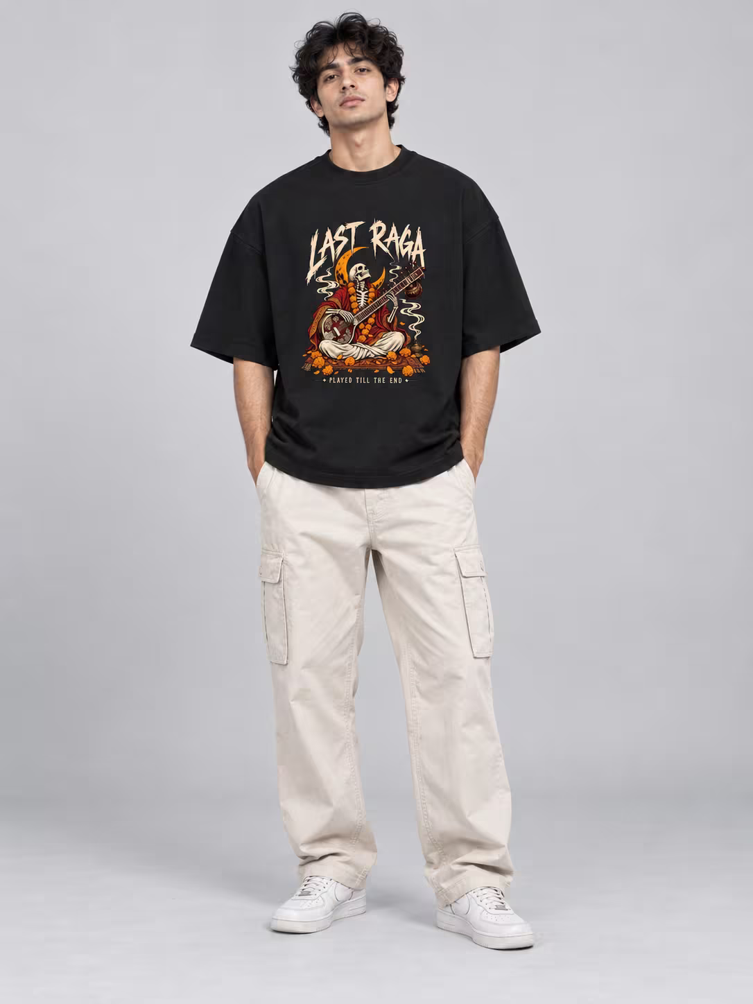 Last Raga Unisex Terry Oversized Tee in Black, worn by a model