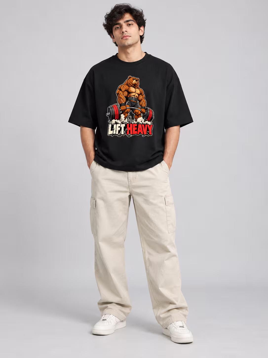 Lift Heavy Unisex Oversized T-Shirt in Black, worn by a model