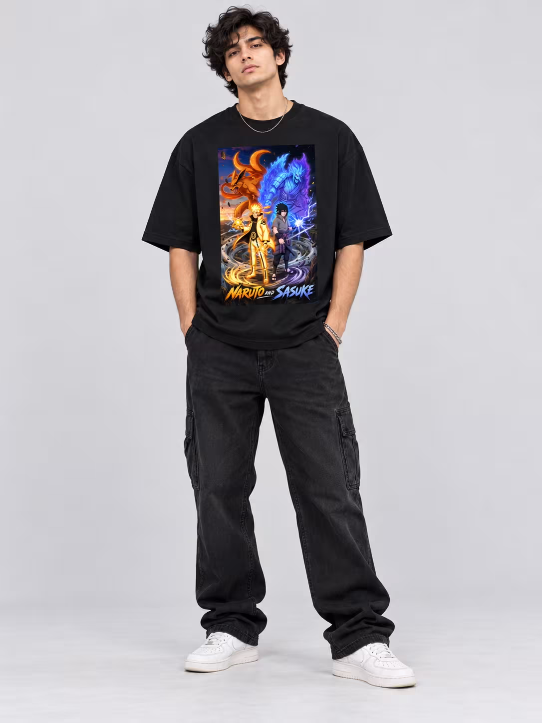 Naruto and Sasuke Unisex Oversized T-Shirt in Black, worn by a model