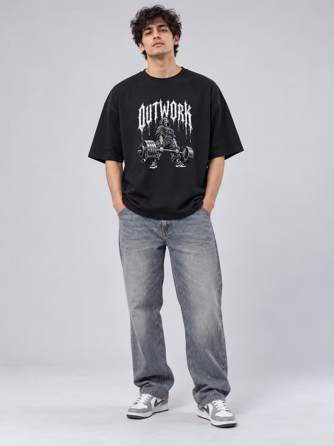 Gym t-shirt: Outwork Unisex Oversized T-Shirt in Black, worn by a model