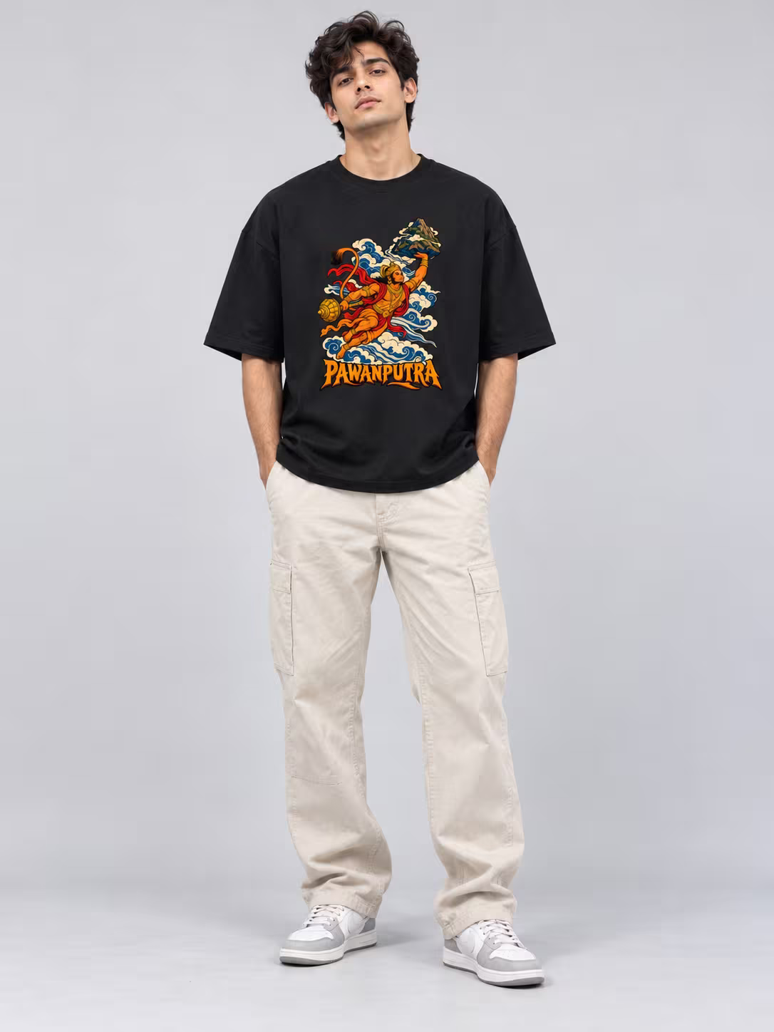Pawanputra Unisex Oversized T-Shirt in Black, worn by a model