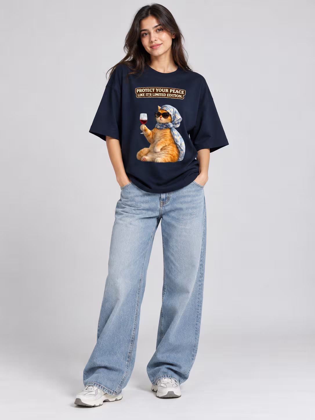 Protect Your Peace Cat Unisex Oversized T-Shirt in Navy Blue, worn by a model