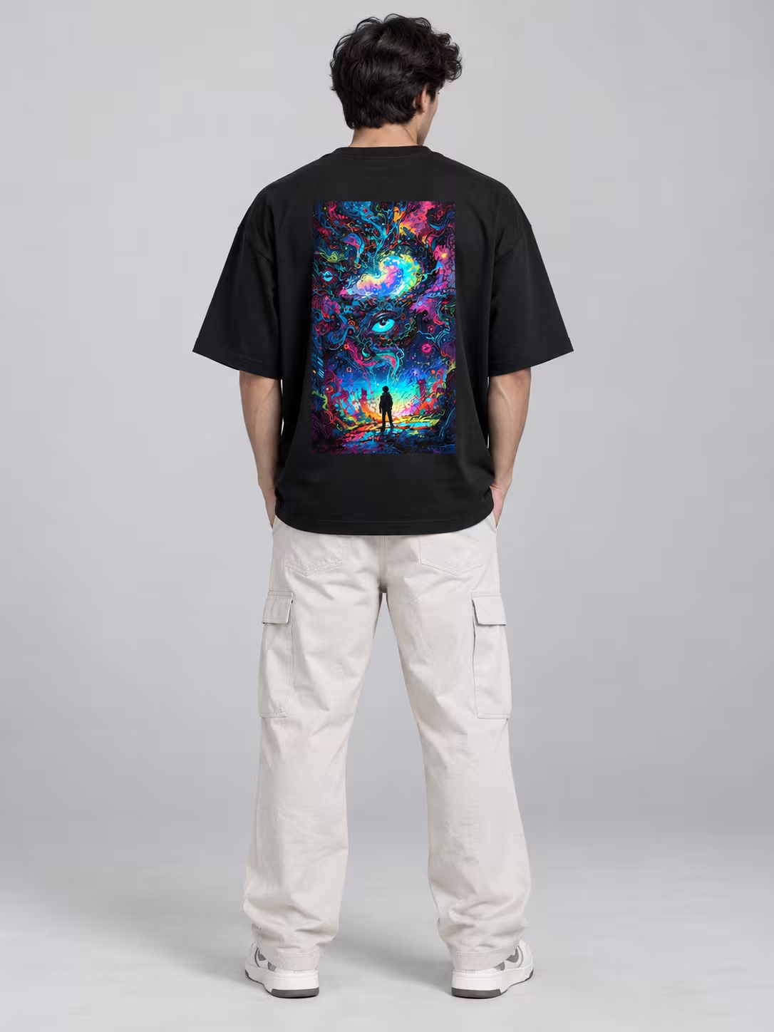 Psychedelic Trippy Unisex Oversized T-Shirt in Black, back print, worn by a model