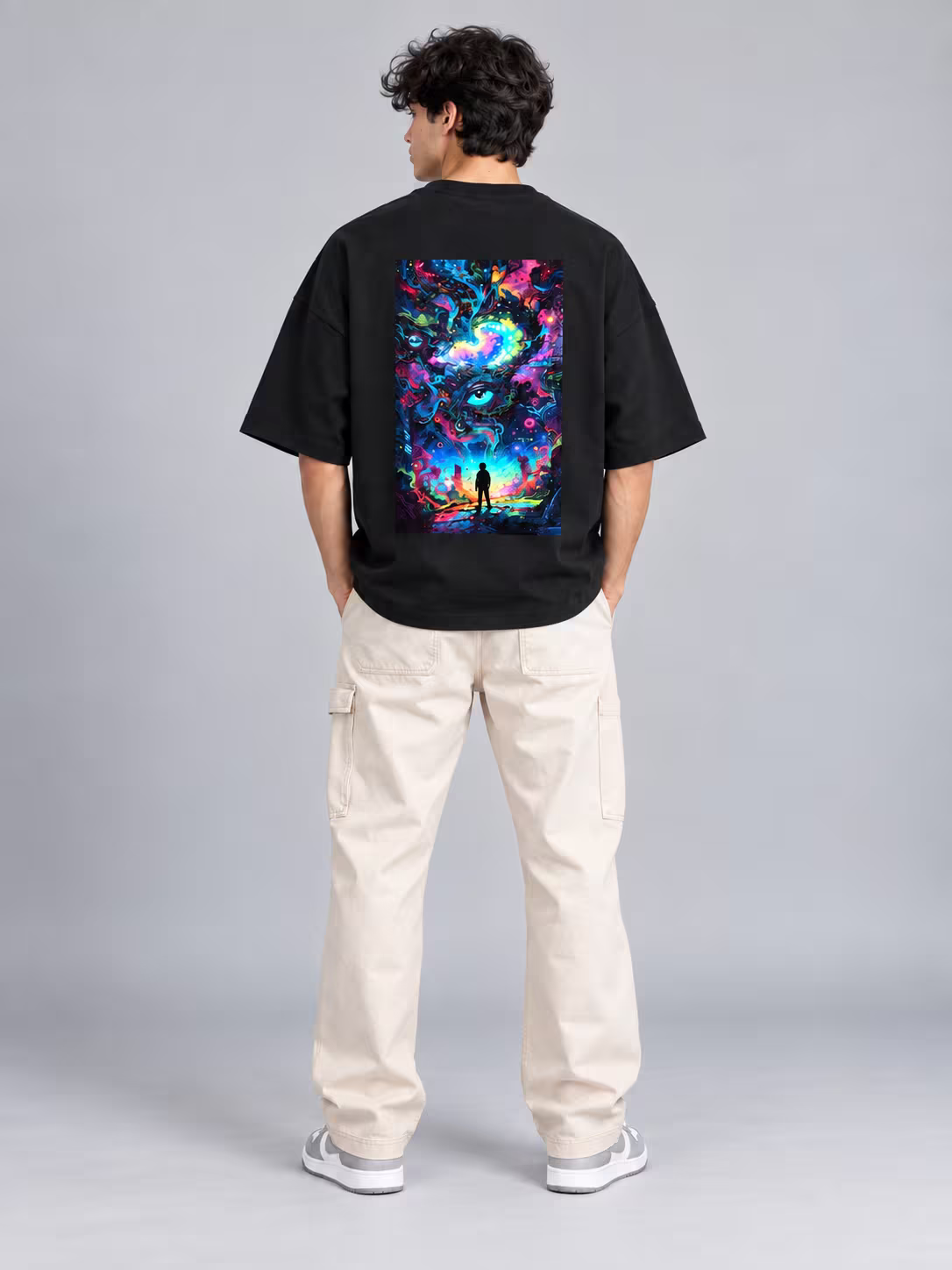 Psychedelic Trippy Unisex Terry Oversized Tee in Black, back print, worn by a model