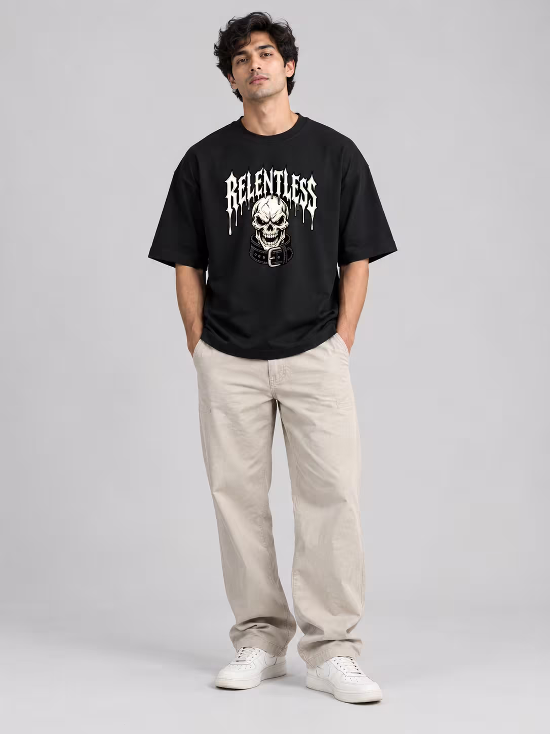 Relentless Unisex Oversized T-Shirt in Black, worn by a model