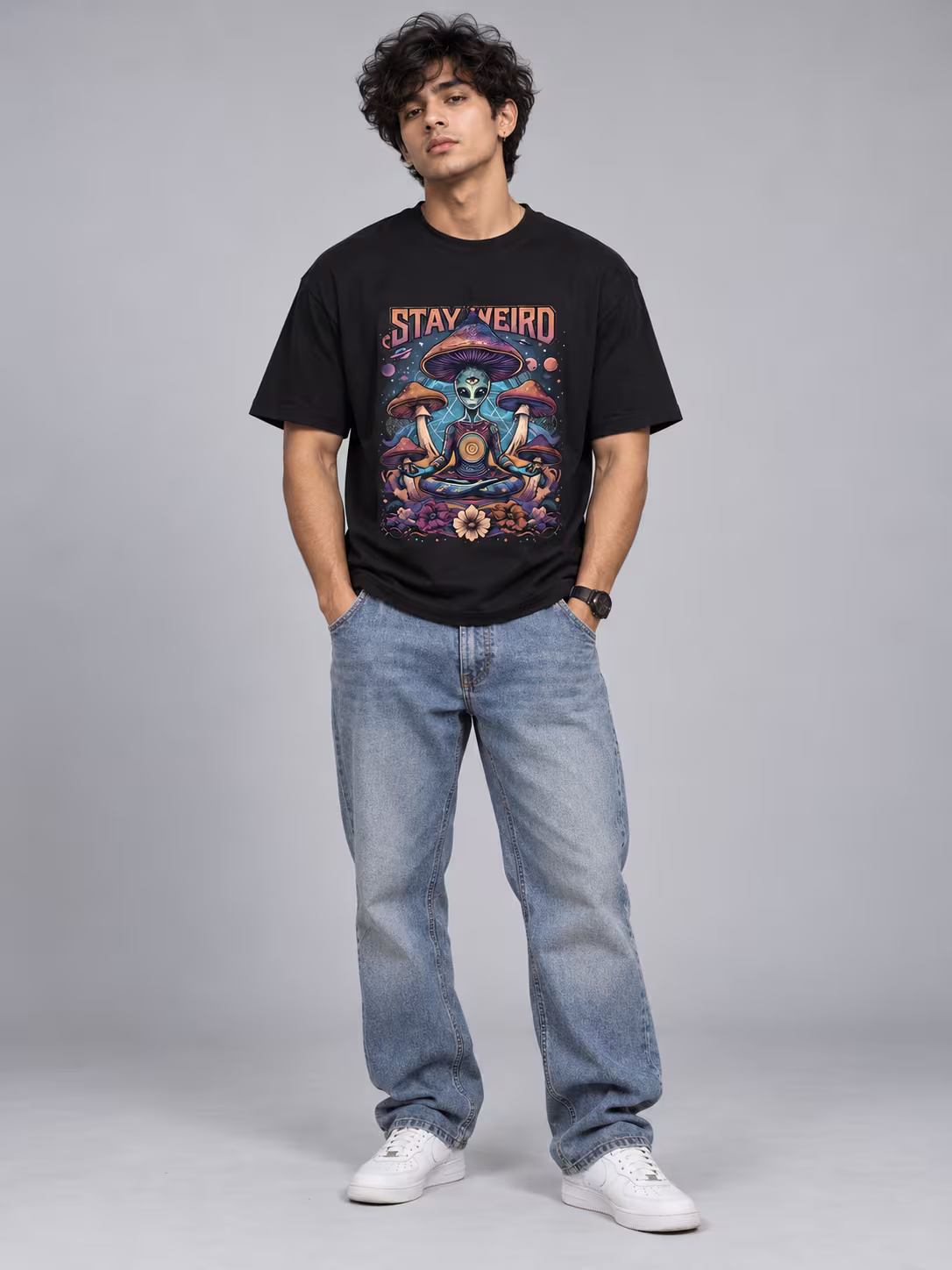 Stay Weird Psychedelic Alien T-Shirt in Black, worn by a model