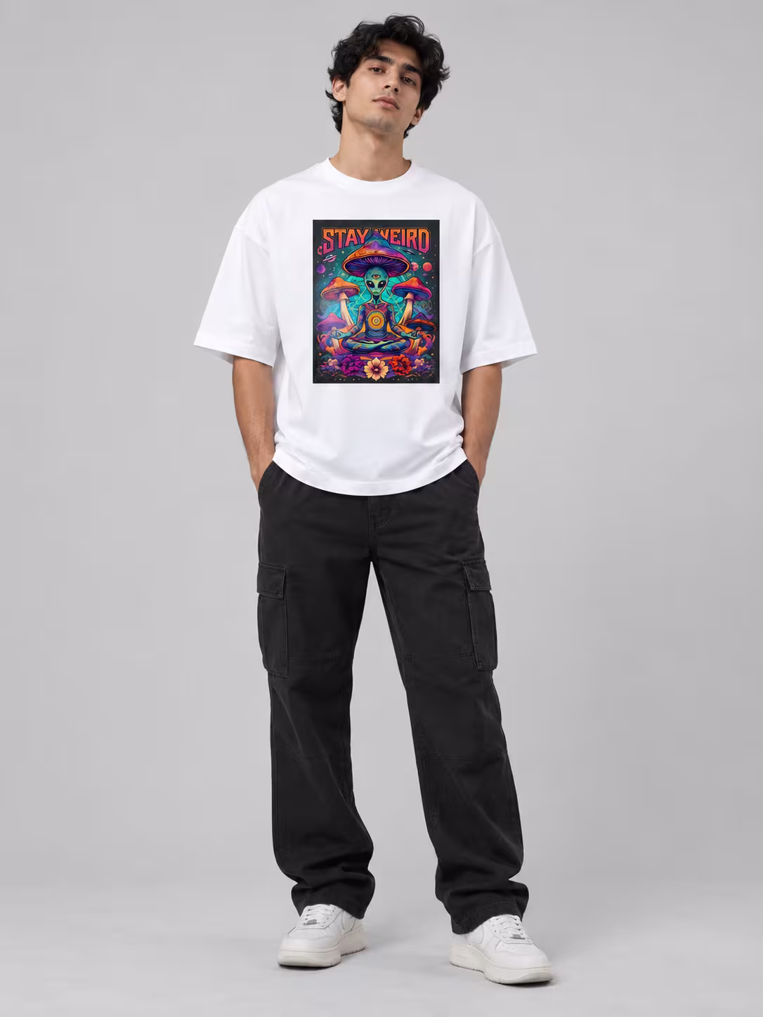 Stay Weird Psychedelic Alien Unisex Oversized T-Shirt in White, worn by a model