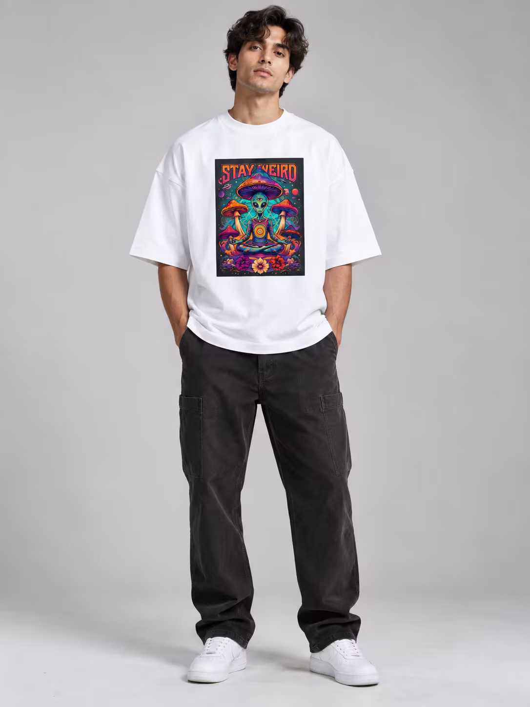 Stay Weird Psychedelic Alien Unisex Terry Oversized Tee in White, worn by a model