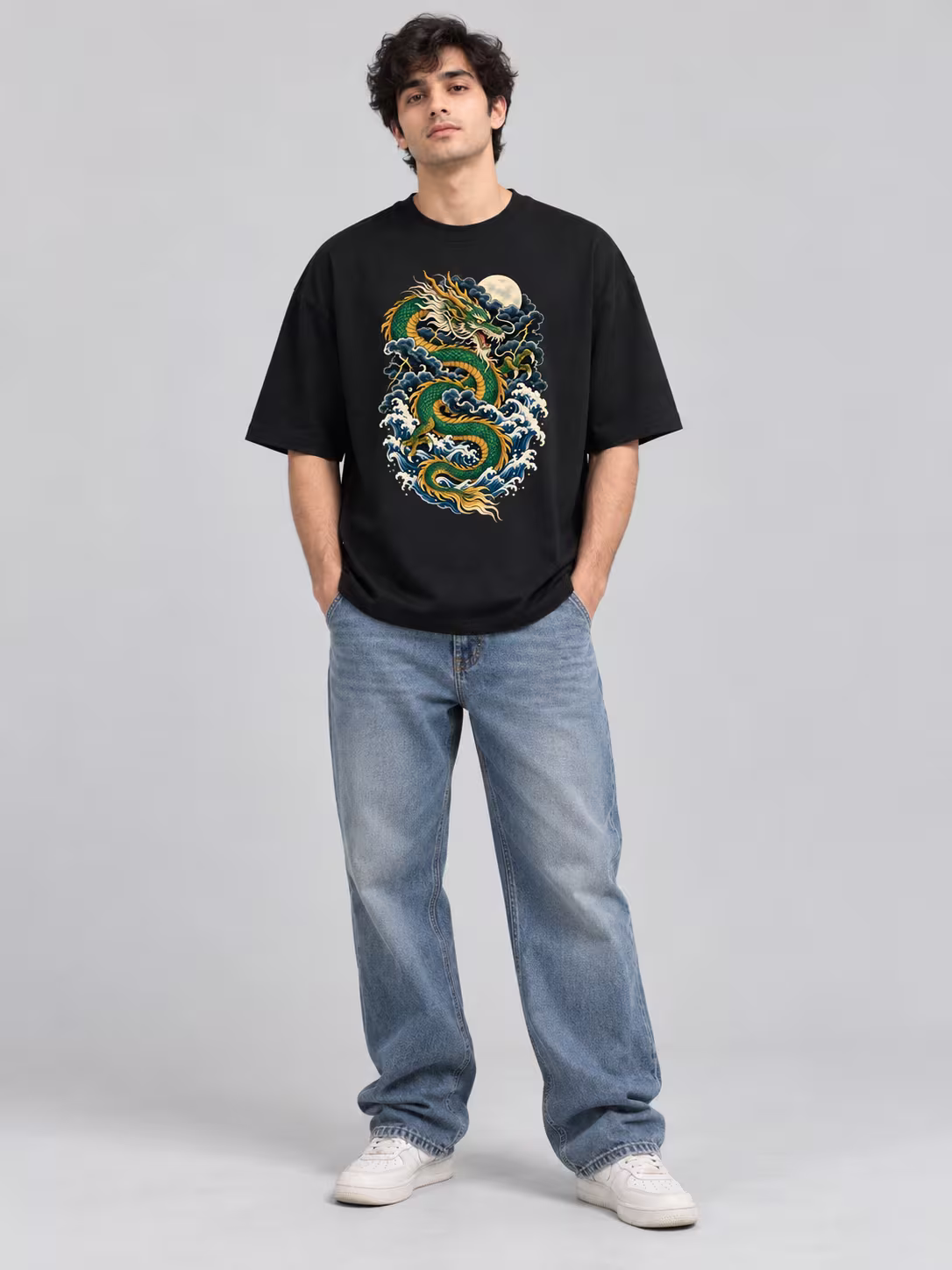 Dragon t-shirt: Storm Dragon Unisex Oversized T-Shirt in Black, worn by a model