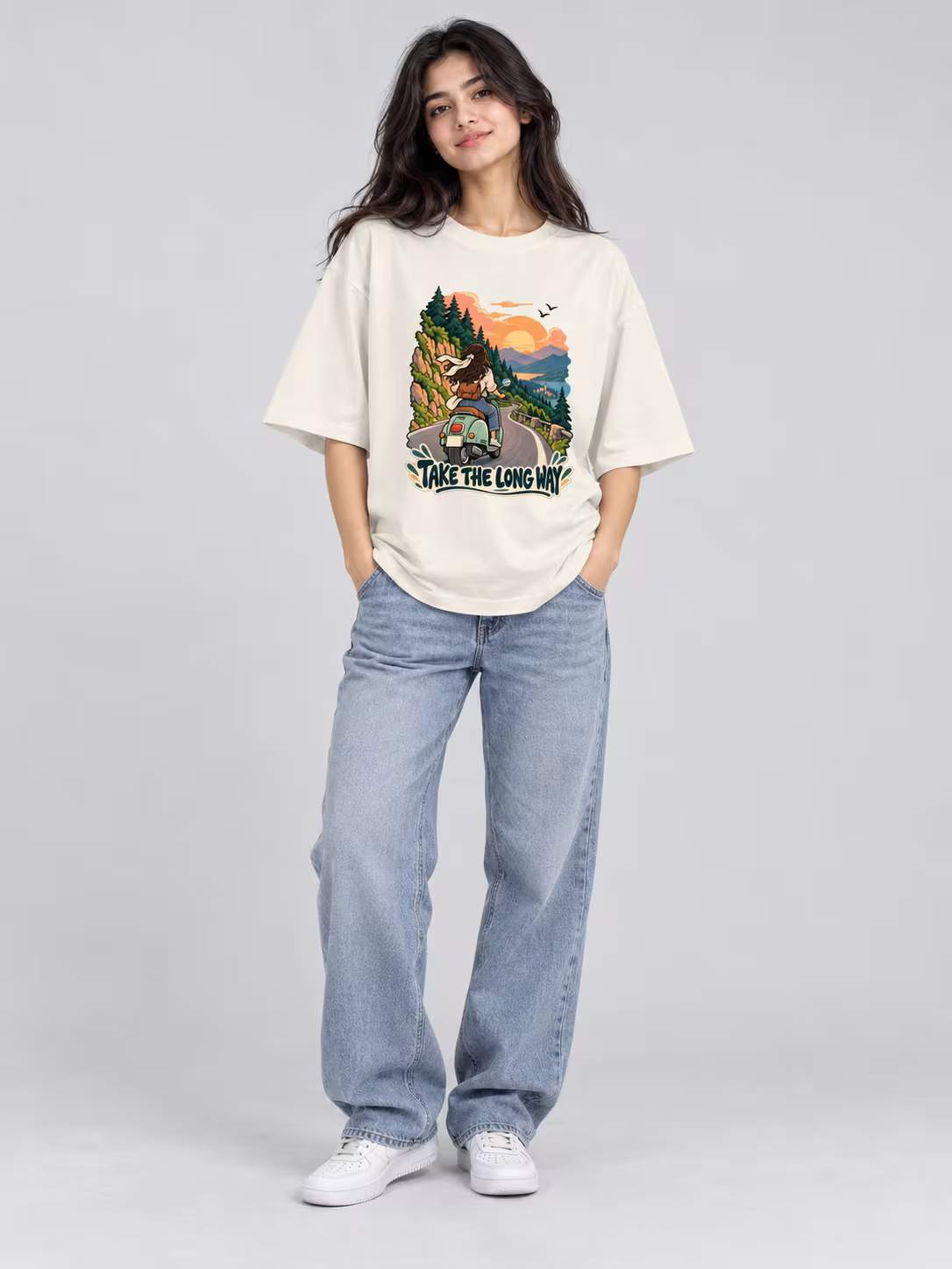 Travel t-shirt for women: Take The Long Way Unisex Oversized T-Shirt in Off White, worn by a model
