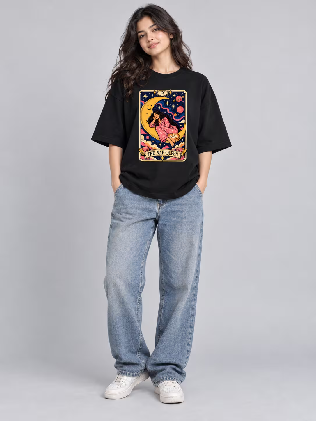 The Nap Queen Unisex Terry Oversized Tee in Black, worn by a model