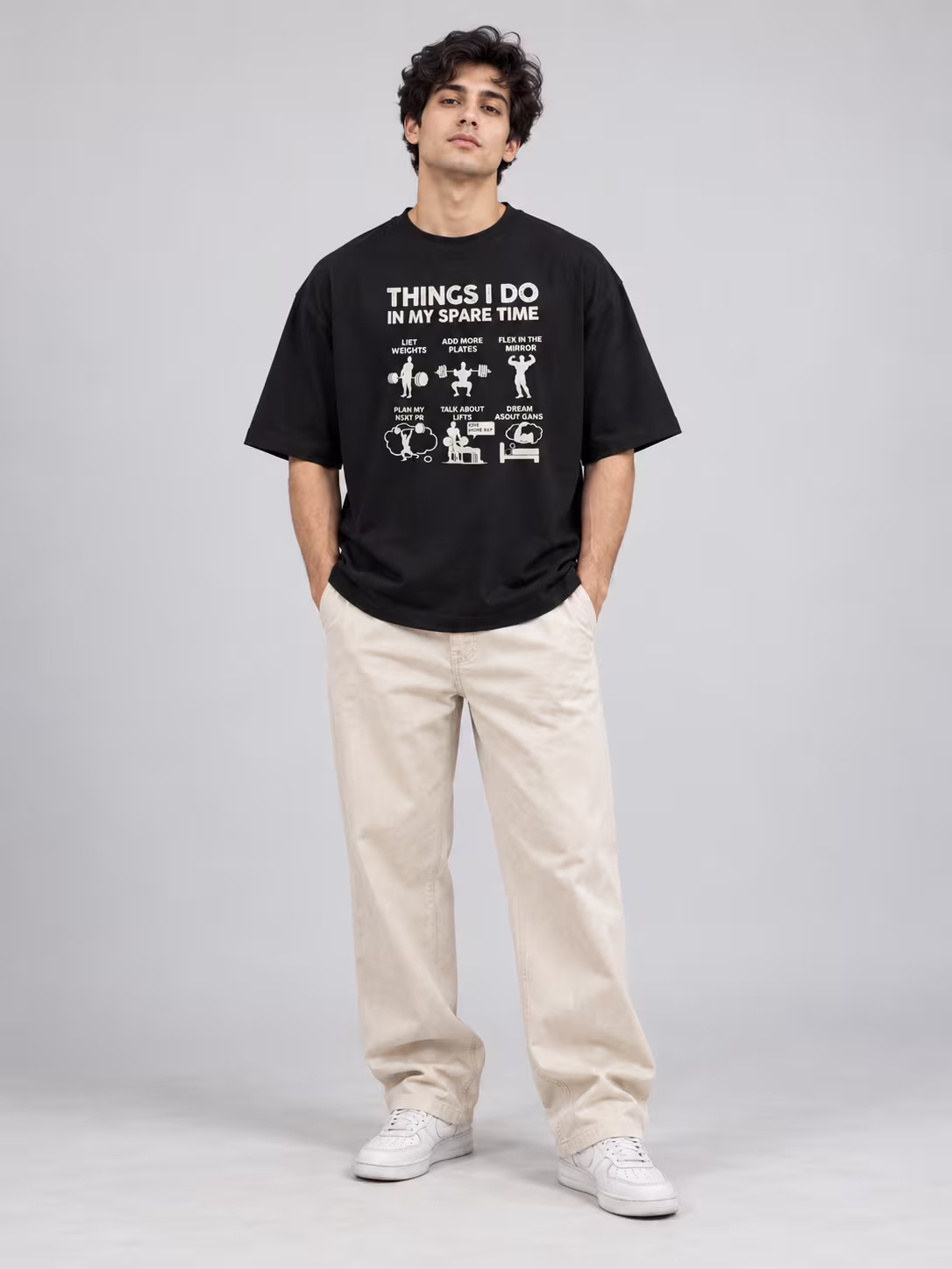 Things I Do In Spare Time Unisex Oversized T-Shirt in Black, worn by a model