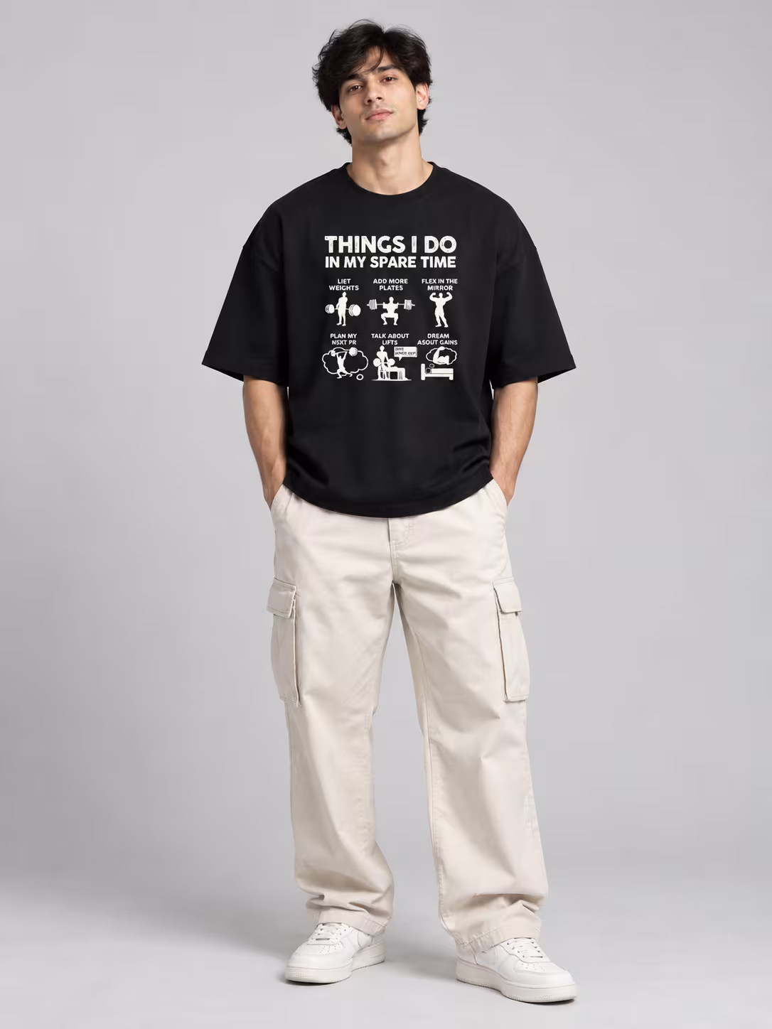 Things I Do In Spare Time Unisex Terry Oversized Tee in Black, worn by a model