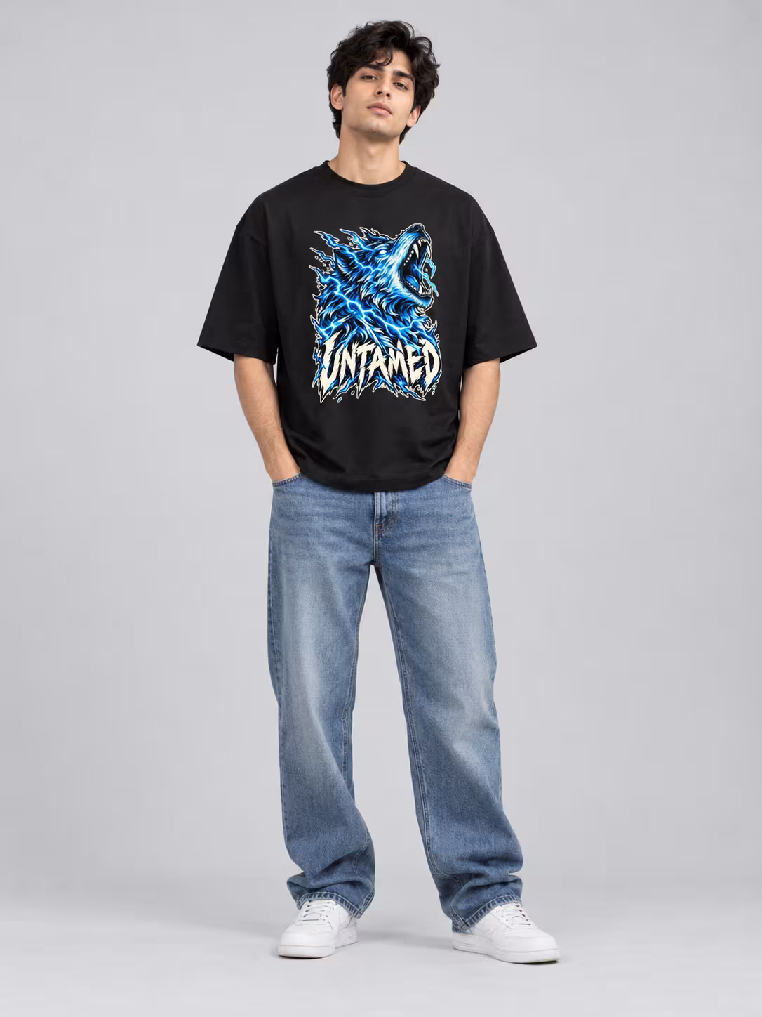 Wolf t-shirt: Untamed Wolf Unisex Oversized T-Shirt in Black, worn by a model