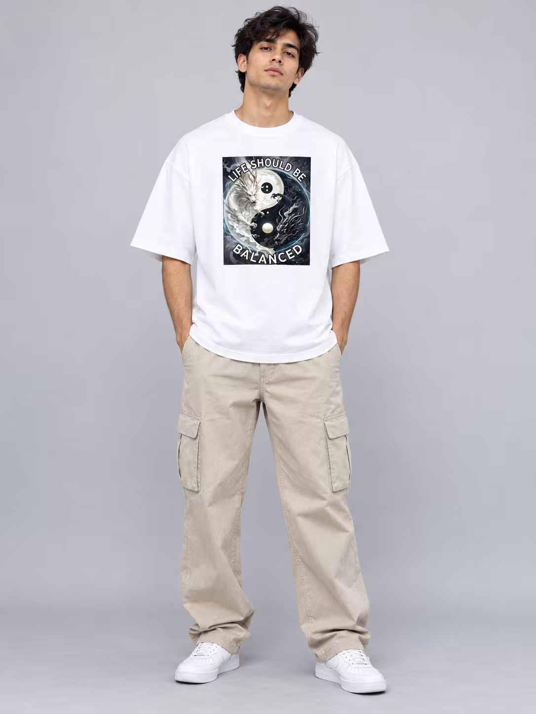 Yin Yang Dragon Unisex Oversized T-Shirt in White, worn by a model