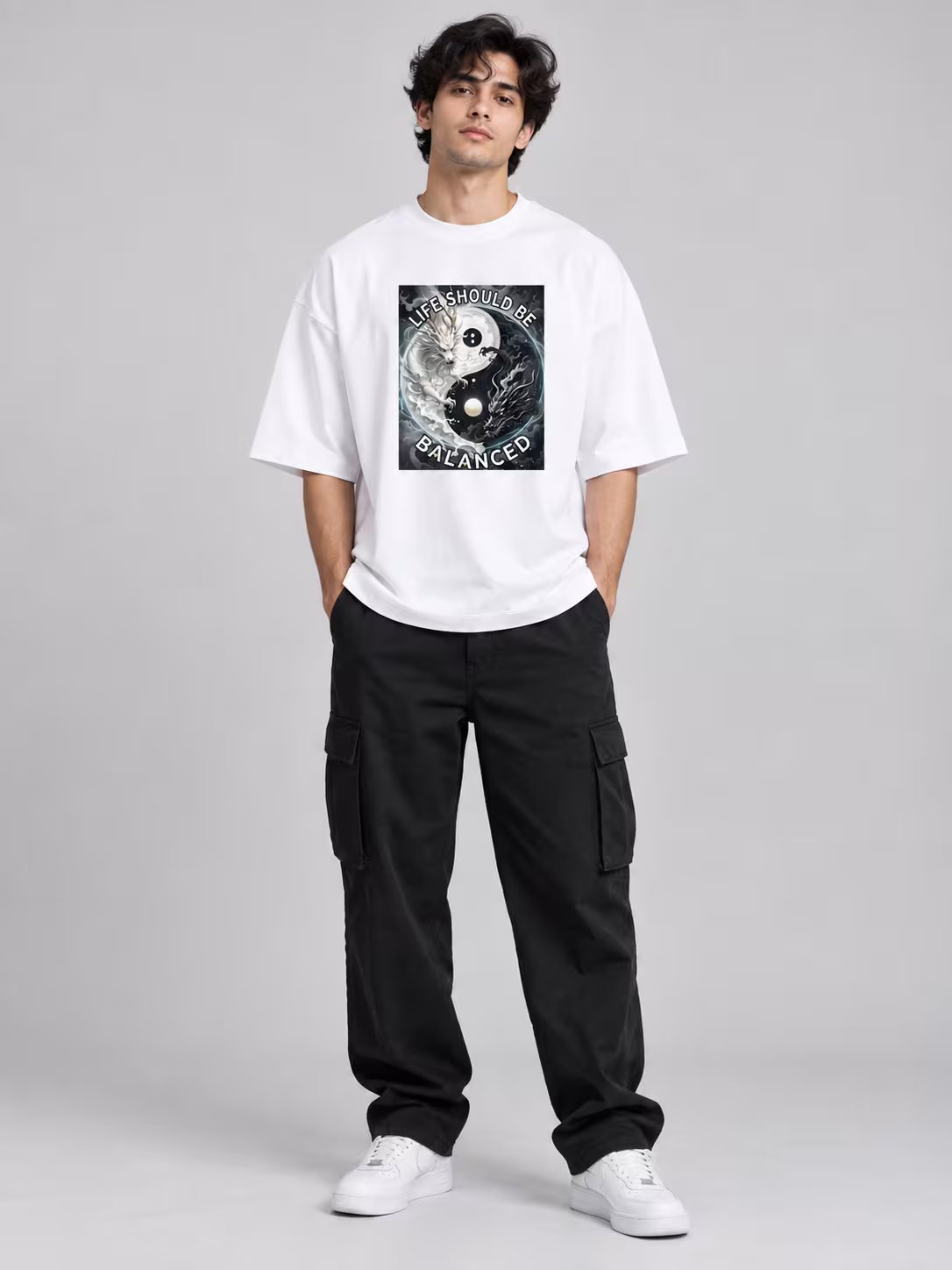 Yin Yang Dragon Unisex Terry Oversized Tee in White, worn by a model