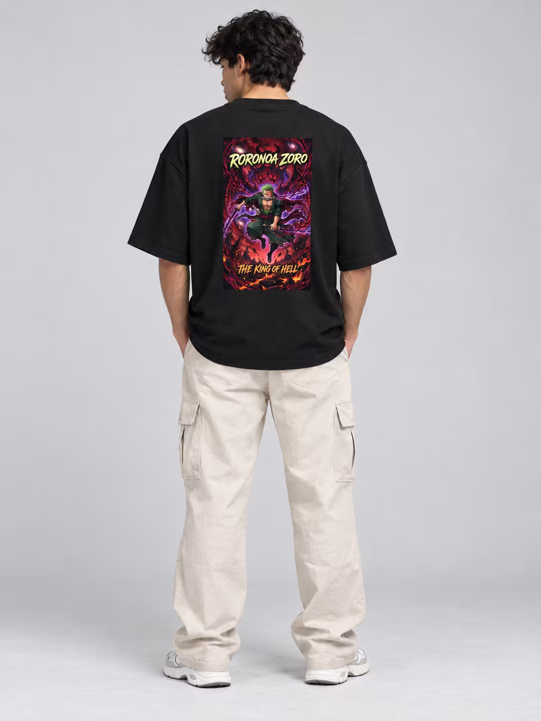 Zoro The King Of Hell Unisex Terry Oversized Tee in Black, back print, worn by a model